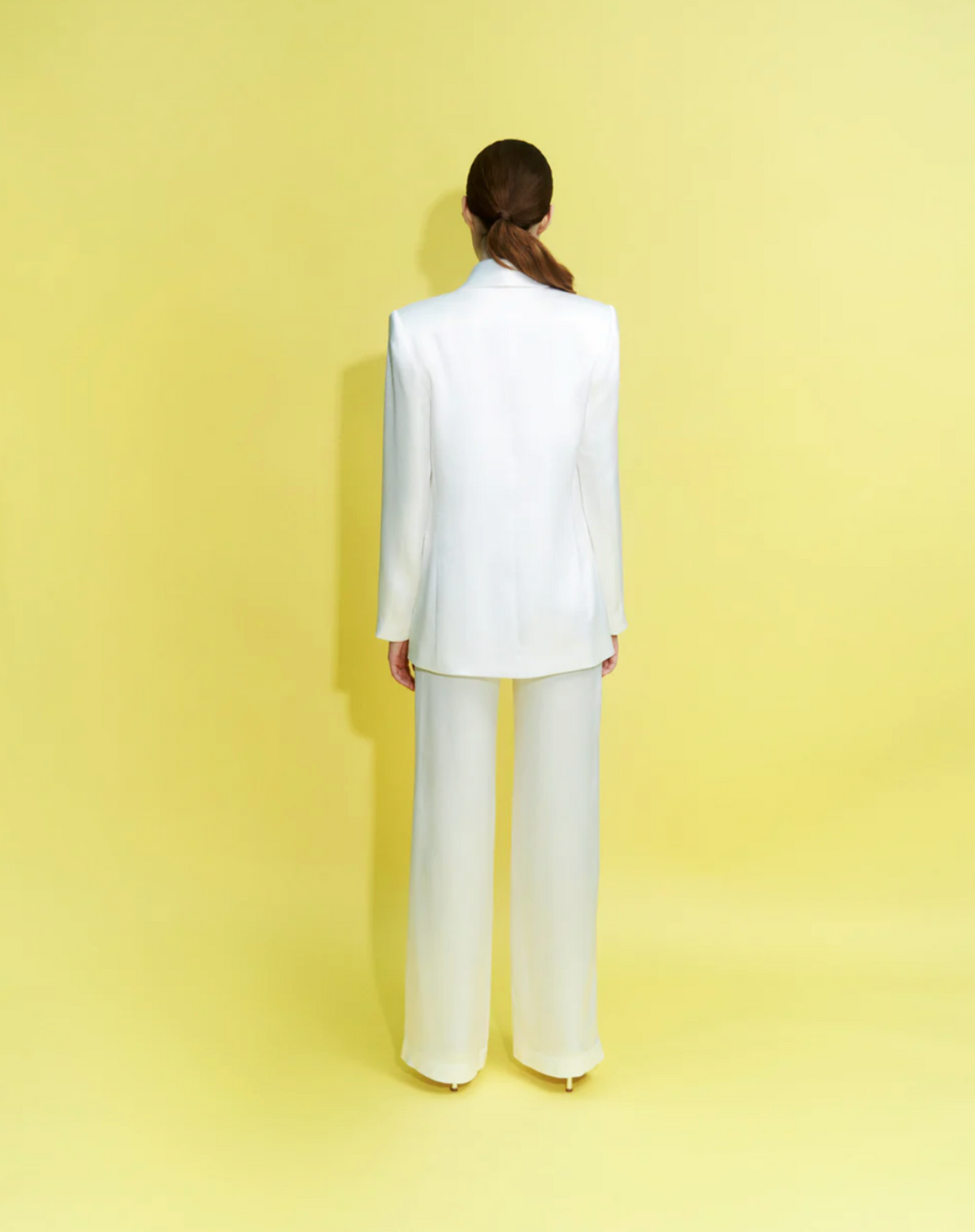 Woman wearing the Eclipse Two Piece Suit Set