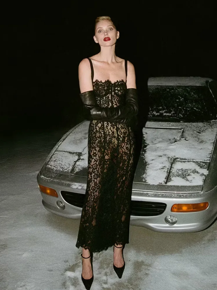 Woman wearing Black Tie Lace Midi on a snowy background