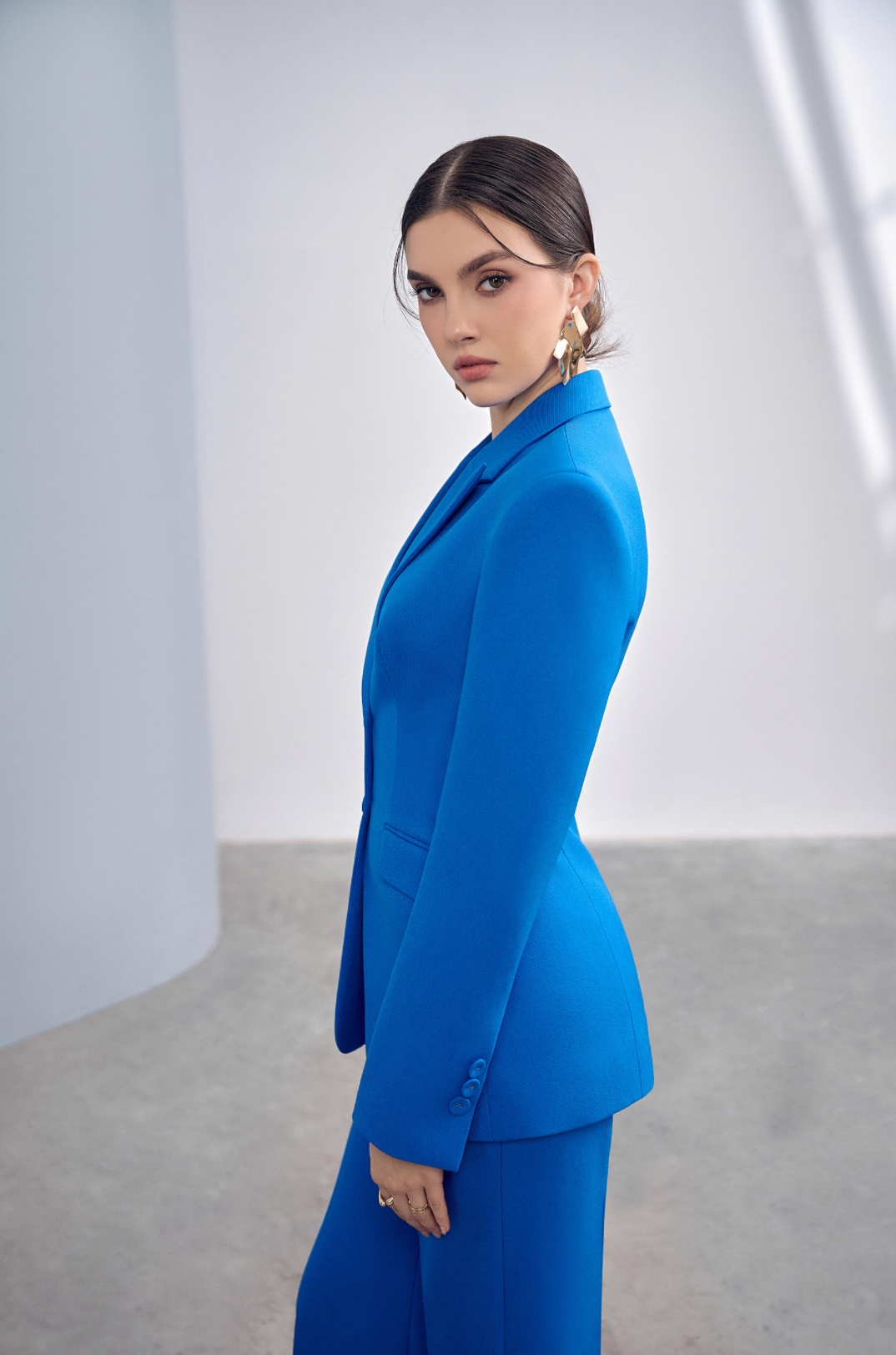 Woman wearing the Old Money Collection Couture Bowery Business Suit
